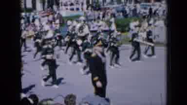 Iowa USA (1959): Band Marches Down Street In A Parade Cuts To Back End Of Float