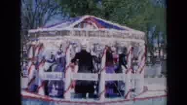 Iowa USA (1959): Parade With Sparkly Floats Driving Down Street With Large Crowds
