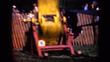 Iowa USA (1959): Machine That Spins Yellow Blade Apparatus Spinning Inside Fenced