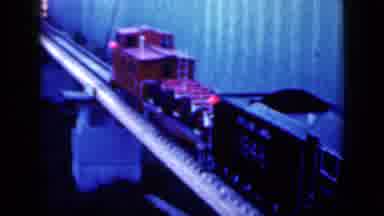 Iowa USA (1959): Train Drives Down The Tracks That Sit On The Narrow Bridge