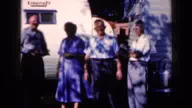 Iowa USA (1959): Three Older Men And An Older Woman Pose Outside Of A House For