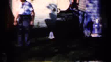 Iowa USA (1959): Men Have Lively Conversations Outside Their Home On A Sunny And
