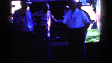Iowa USA (1959): Three Men In Hats In A Dark Outdoor Place In Front Of A Care