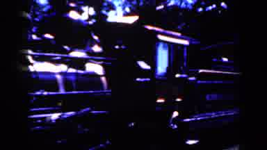Iowa USA (1959): Old Midwest Central Locomotive Carries Passengers In Train Car