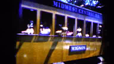 Iowa USA (1959): Scene Of People Riding A Train Trolley As It Passes By And Then