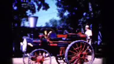 Iowa USA (1959): View Of Red And Black Steam Powered Vehicle On A Sunny Day