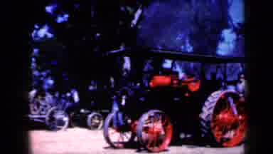 Iowa USA (1959): View Of Red And Black Steam Powered Vehicle On A Sunny Day