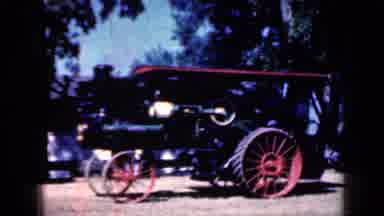 Iowa USA (1959): Old Fashioned Train Engine Carrying People Alongside A Moving
