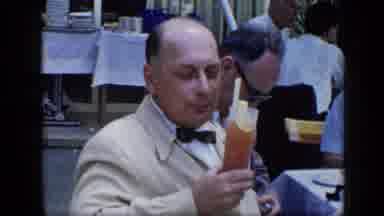 VENEZUELA-1959: Mature Man Sips Drink At Restaurant Table