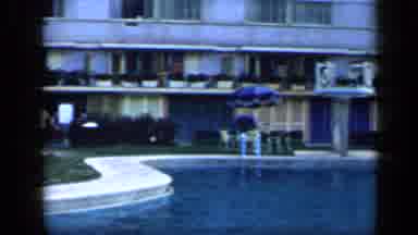 Venezuela (1959): Two People Swimming In An Outdoor Pool At A Hotel