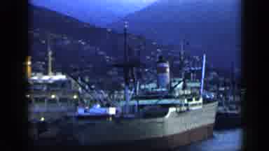 VENEZUELA-1959: Camera Pans Passed Parked Boats In Port City Then Goes To Sunset