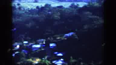 Venezuela (1959): Scene Passes From Upstairs Exterior Of A White Home To Houses In