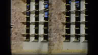 VENEZUELA-1959: Panning View of Weathered Apartment Complex with Stone Facade