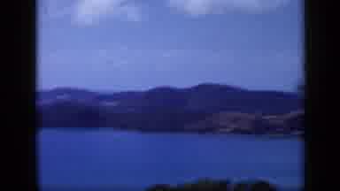 Venezuela (1959): Panning Shot Scenic Overlook Above A Bay In Between Hills On