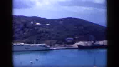 Venezuela (1959): Two Boats Docked Near Hillside Then White Shingles On Roof Of