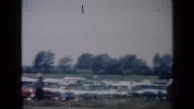 Missouri USA (1961): A Large Gathering Of People With Some Cars In The Background