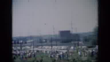 Missouri USA (1961): People Walking In A Park In America With Flags Waving