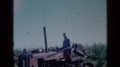 Missouri USA (1961): Man Sits On Top Of His Tractor Then Uses Machinery To Push