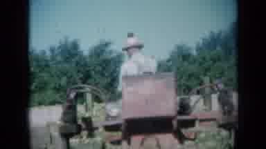 Missouri USA (1961): Older Man Backs Up Red Grader Then Pushes Dirt Forward