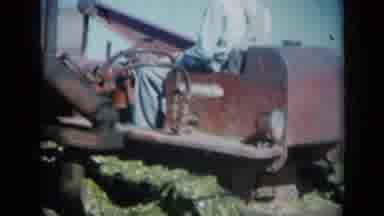 Missouri USA (1961): One Man Operates Big Vehicle While One Man Poses Holding Fish