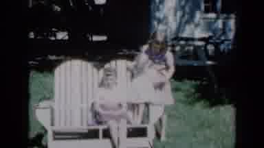 Missouri USA (1961): Standing Girl Helps Comfort Youngest Girl On Seat As Another