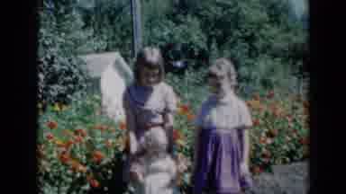Missouri USA (1961): Children Outside Their Residence With A Flower Garden In The
