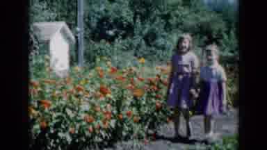 Missouri USA (1961): Two Sisters Walking Through The Garden Enjoying A Sunny Day