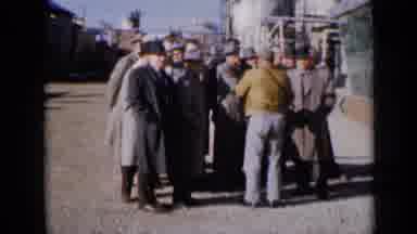 Missouri USA (1961): A Small Group Of Men Wearing Coats And Hats Talk Amongst Each