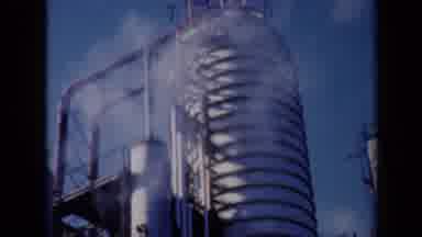 Missouri USA (1961): Steam Is Emitted From Industrial Rooftop Equipment At A