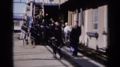 Missouri USA (1961): Men Crowded At The Bottom Of A Staircase To A Building