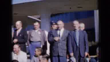 Missouri USA (1961): Men Gather And One Man Puts A Hat On Another Man Who Makes