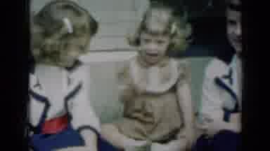 Missouri USA (1961): Little Girl Tells Her Friend To Look While Sitting On A Bench