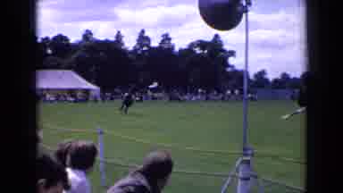 England-1963: Black And White Horse Racing In A Park With Crowd Watching