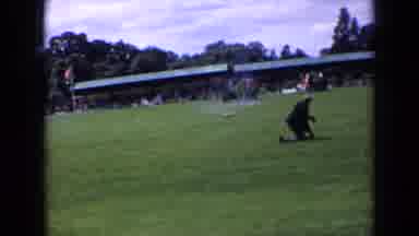 England (1963): The Crowd Watches As The Horse And Rider Take On The Jumps On The