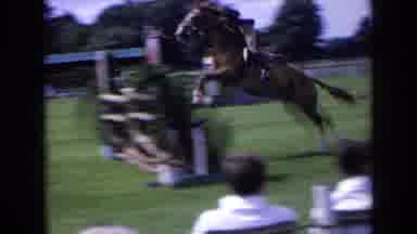 England (1963): Person Horse Riding Over Obstacle Course While People Watch
