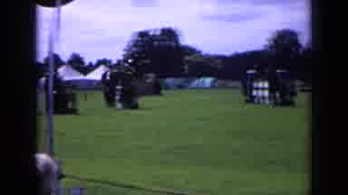 England (1963): People Watching Horse Show With Horses Jumping Fences And
