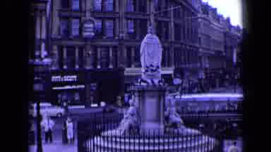 England (1963): The Camera Spans An Ornate Outdoor Fountain And Then A Church