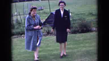 England (1963): Friends Walking In The Backyard Enjoying Their Time With Family