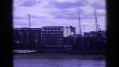 England (1963): Panning Footage Of Ocean Front And A Busy Bus From The Past