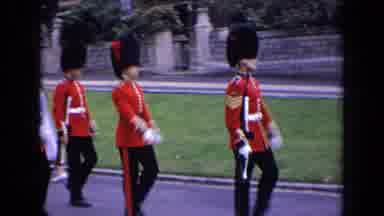 England (1963): Large Castle Structure Panning Down To The Marching Royal Guards