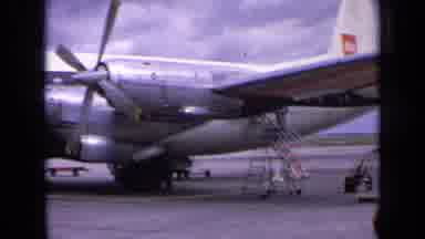 England (1963): People Departing From An Airplane And Collecting Their Luggage