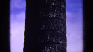 England (1963): View Of Dark Grey Towering Object On A Clear Sunny Day