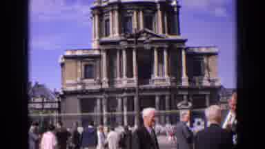 France (1963): Older Balding Men Gathering In Front Cathedral Shown Panning Up