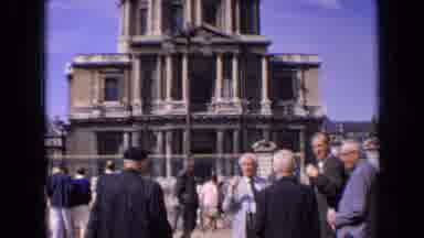 France (1963): People Milling Outside A Building
