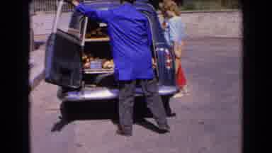 France (1963): Baker Shows Off His Wares Then Closes The Rear Door Of His Vehicle