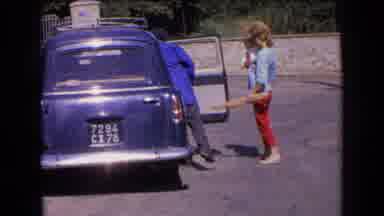 France (1963): A Family Members Are Take Some Things In Car
