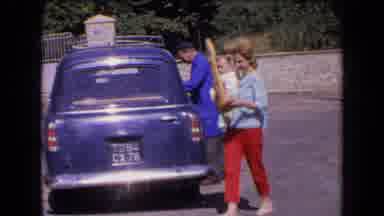 France (1963): Child Wearing Blue Shorts Pets Black And White Cow On A Bright