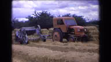 France (1963): A Tractor In A Field With Dry Grass Dragging A Machine Preparing