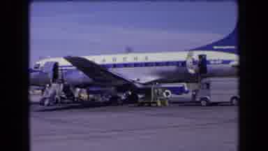 France (1963): An White And Blue Airplane In An Airport Preparing To Fly