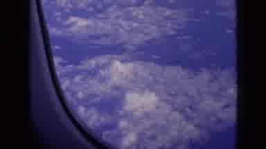 London England-1963: Blue Sky With Clouds As Seen From An Airplane Window While In Flight